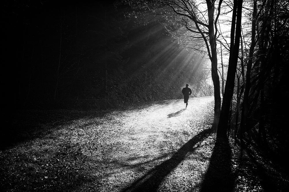 Lone Runner Sun Rays by Jurij Bizjak — canvas wall art