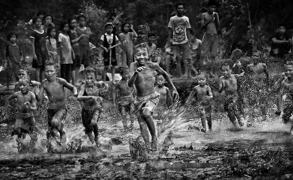 Joyful Children Splashing Race by Adhi Prayoga — canvas wall art