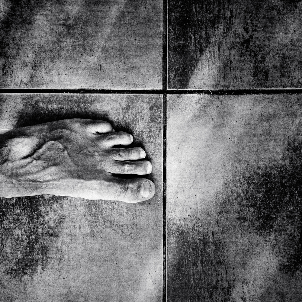 Bare Foot on Gritty Tile by txules — canvas wall art