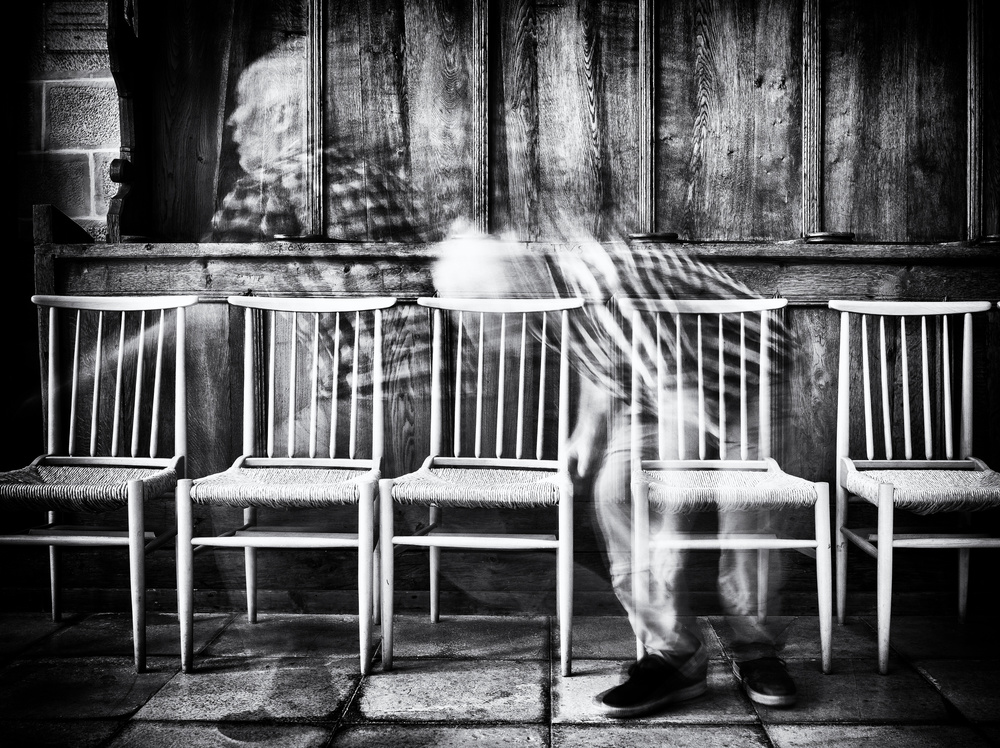Blurred Figure Empty Chairs by Jürgen Hartlieb — canvas wall art