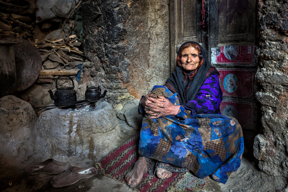Woman By Stone Hearth by Mohammadreza Momeni — canvas wall art