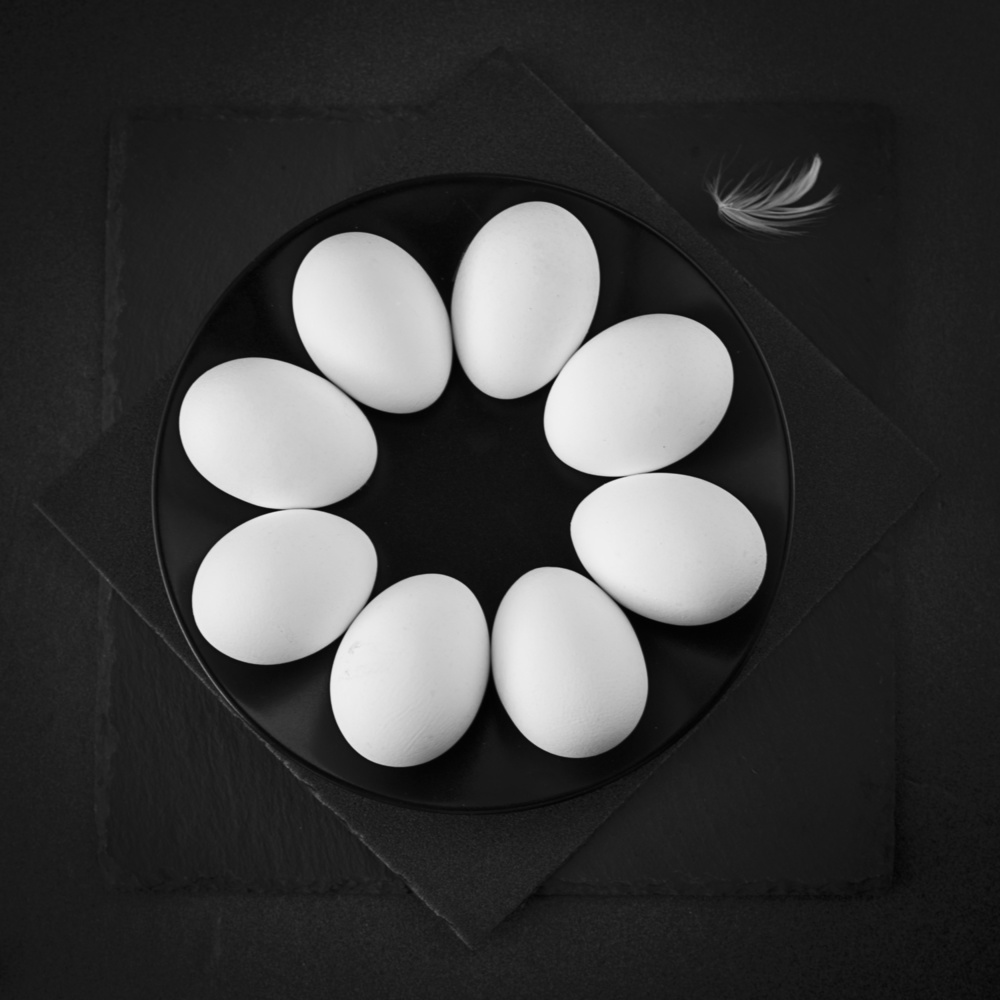 White Eggs Dark Plate by Zlatina Peeva — canvas wall art