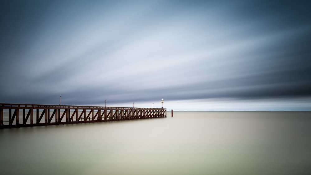 Moody Pier Horizon by Christophe Staelens — canvas wall art