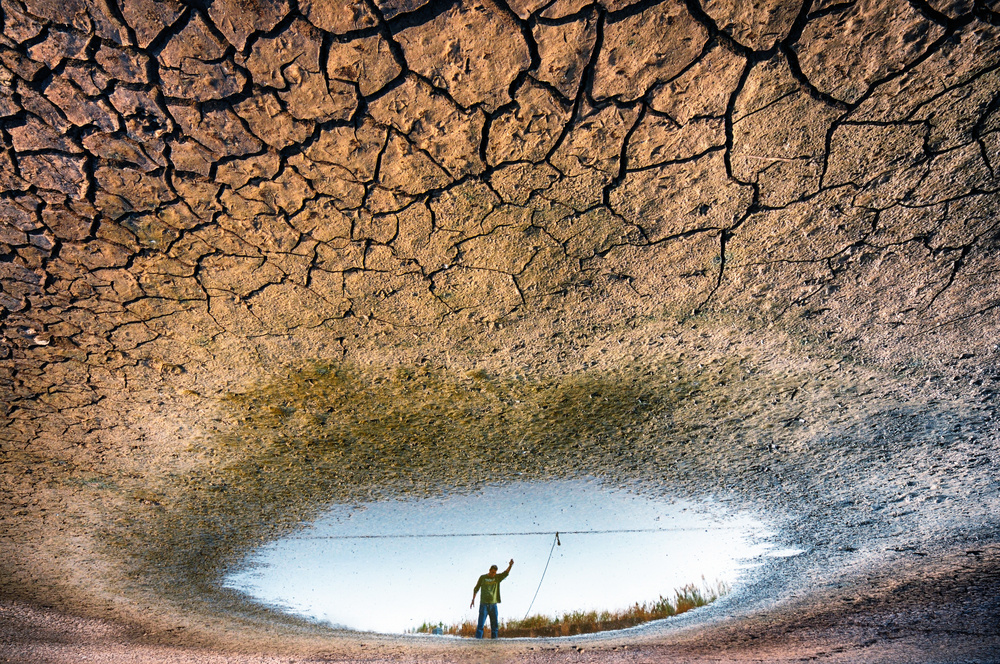 Cracked Earth Reflection by Miki Meir Levi — canvas wall art