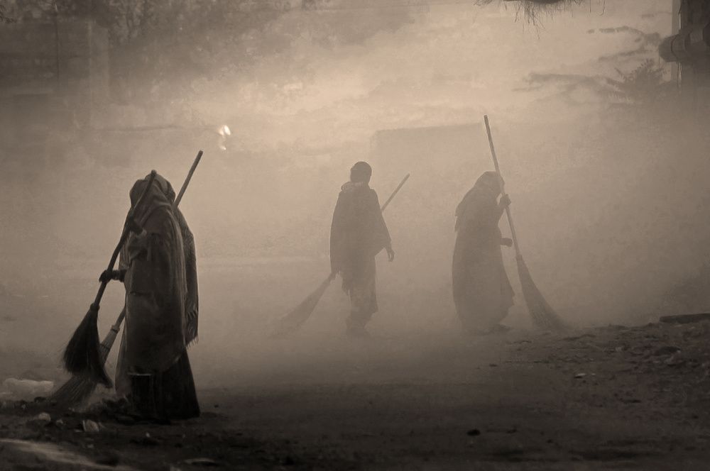 Women Sweeping Dusty Street by Lou Urlings — canvas wall art