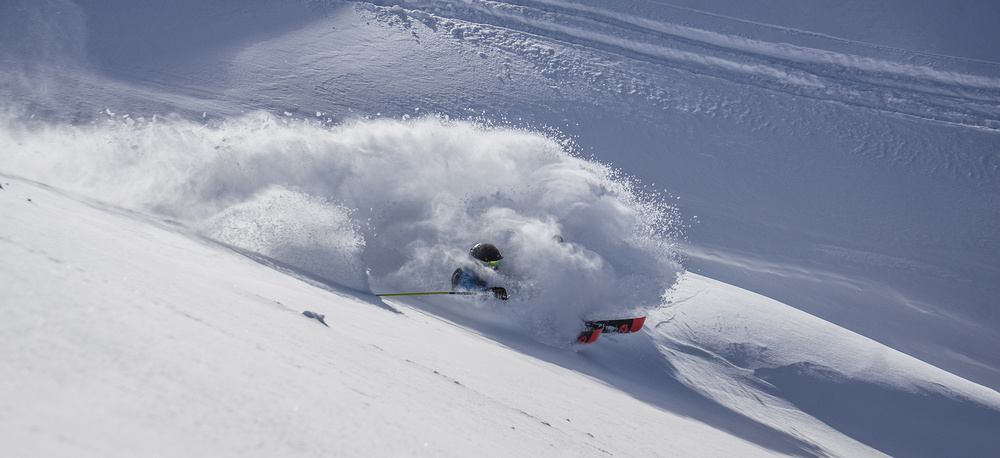 Skier Blasting Powder by Jake Gifford — canvas wall art