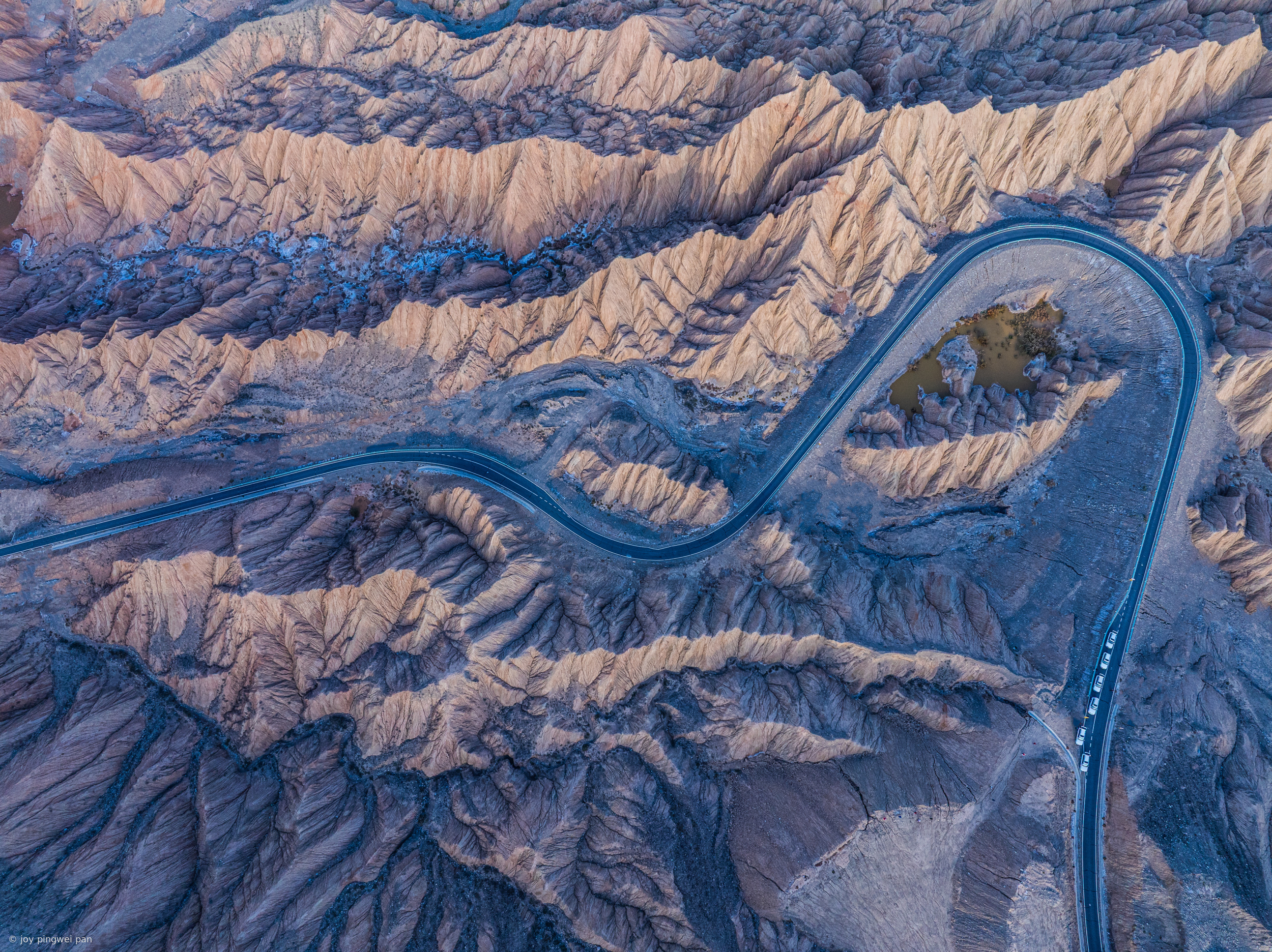Winding Mountain Road Through Badlands