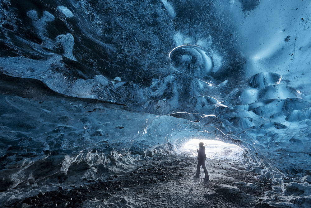 Blue Ice Cave Explorer by Rafal R. Nebelski — canvas wall art