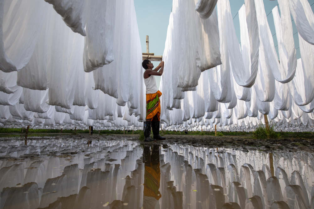 Drying White Fabrics Reflection by Azim Khan Ronnie — canvas wall art
