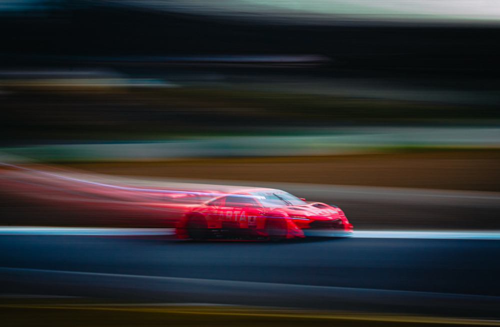 Speeding Red Race Car by Haruaki Taguchi — canvas wall art