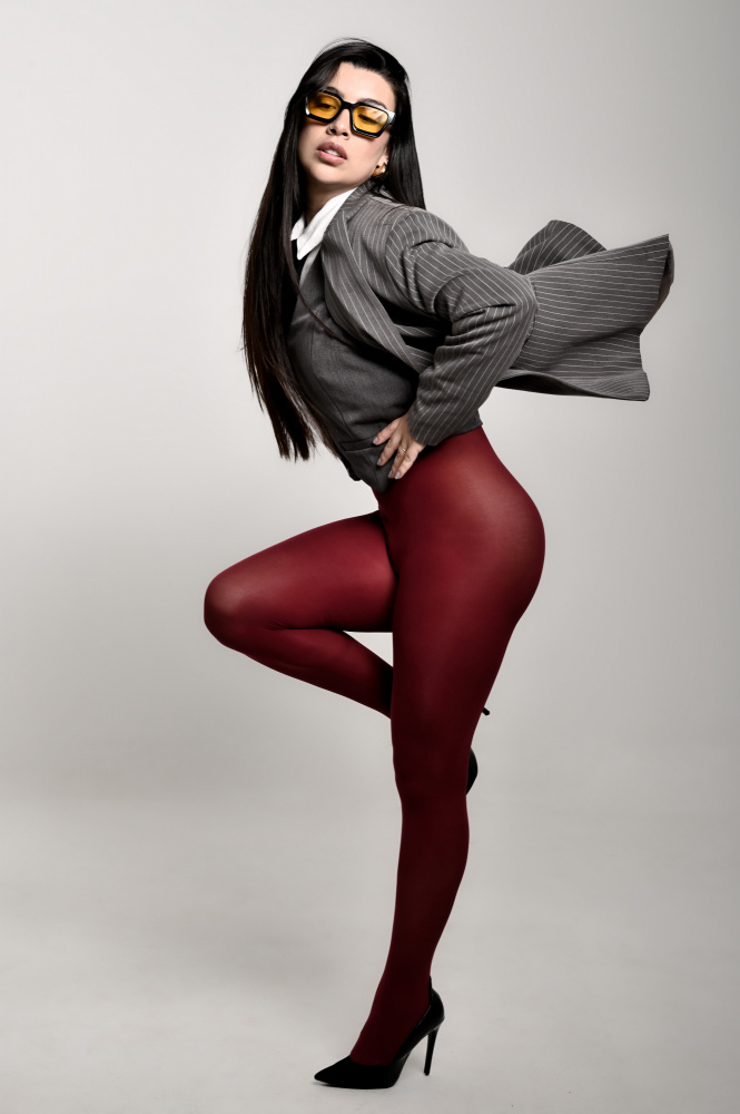 Confident Woman Red Tights by Cesar Tejada — canvas wall art
