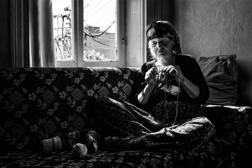 Knitting by Window Light by Yasemin Bakan — canvas wall art