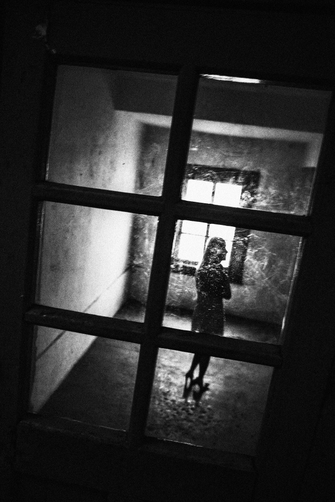 Solitary Woman Through Window by Parole Kim — canvas wall art
