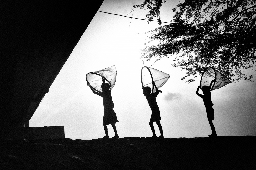 Playing Children Silhouettes by Avishek Das — canvas wall art