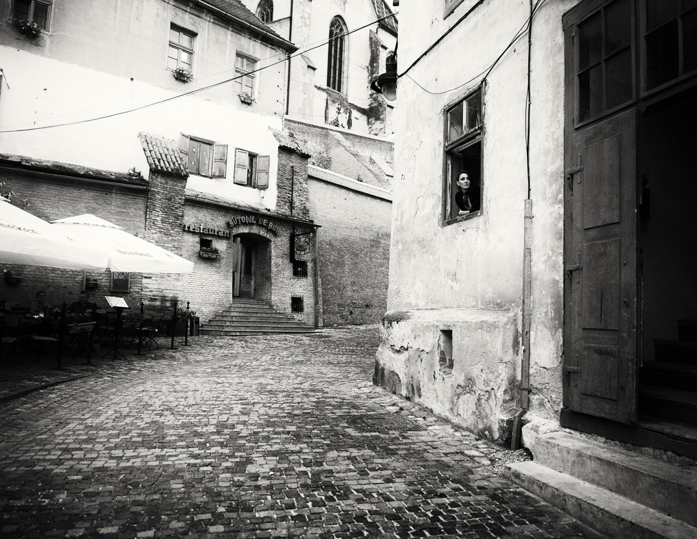 Window Watcher Cobblestone Street by Julien Oncete — canvas wall art