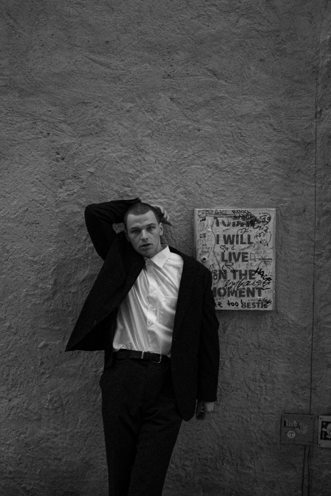 Pensive Man Black Suit by Samuel Sleziak — canvas wall art