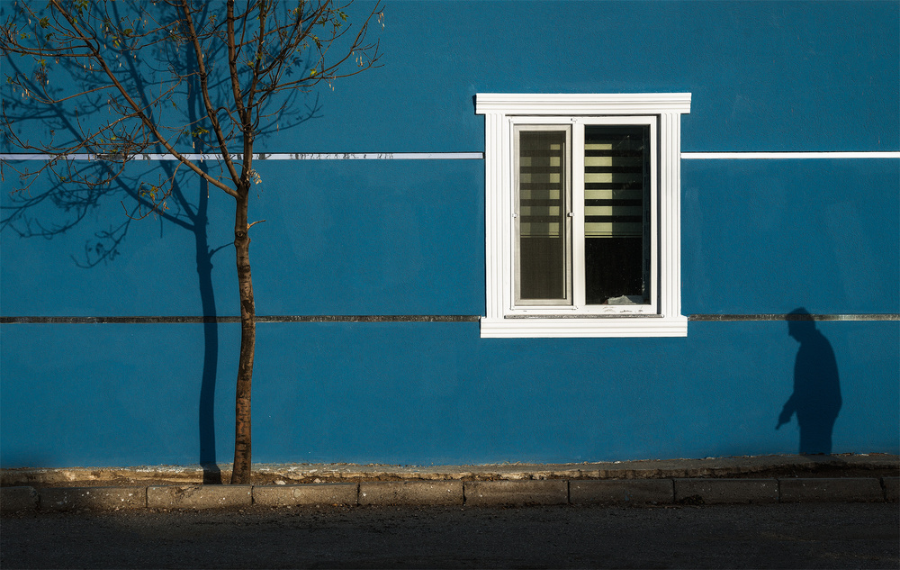 Blue Wall Long Shadows by Yavuz Pancareken — canvas wall art