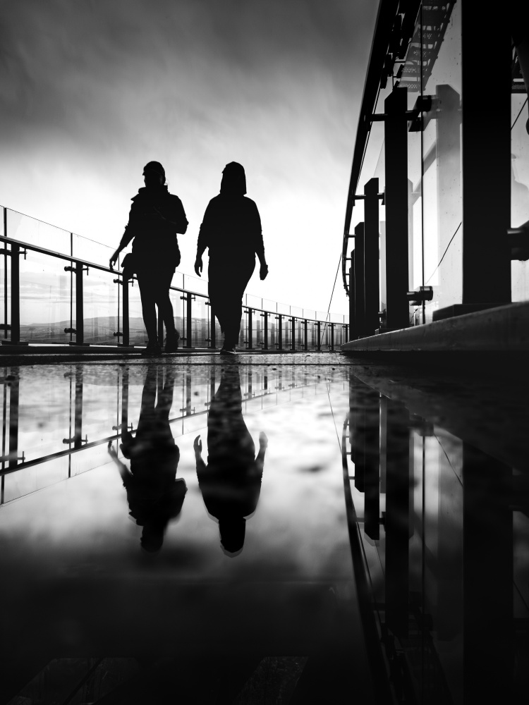 Silhouettes On Reflective Walk by Doruk Uysal — canvas wall art
