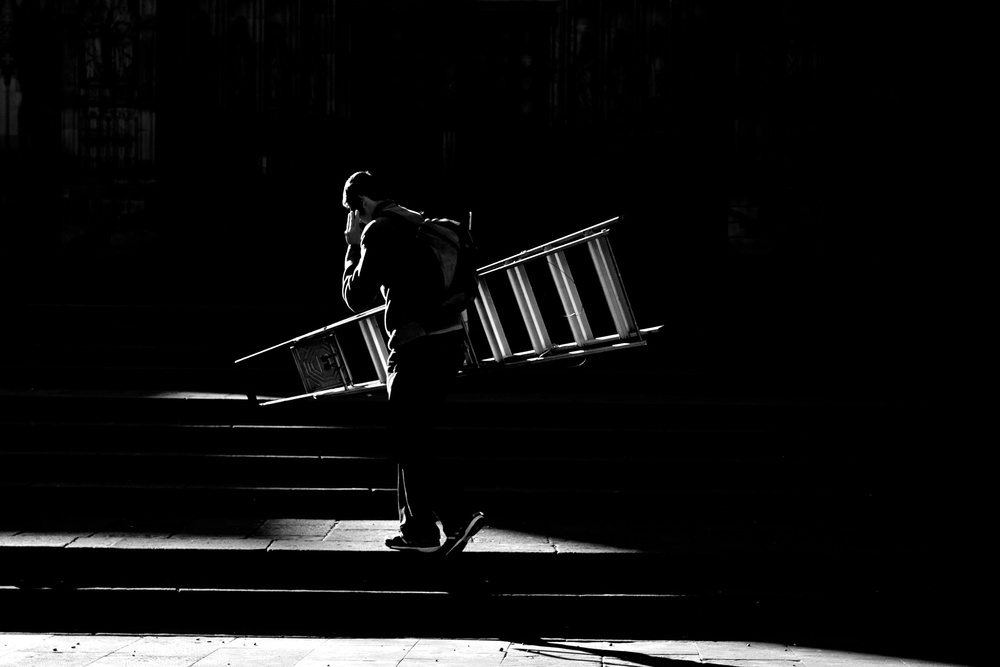 Man Carrying Ladder by Ignasi Raventos — canvas wall art