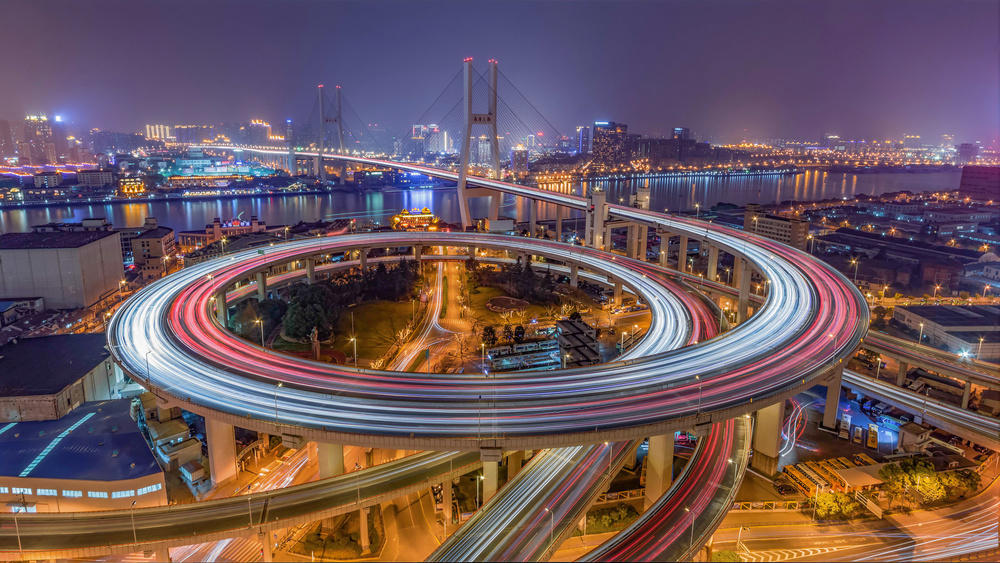Urban Spiral Light Trails by Zhibo Chen — canvas wall art