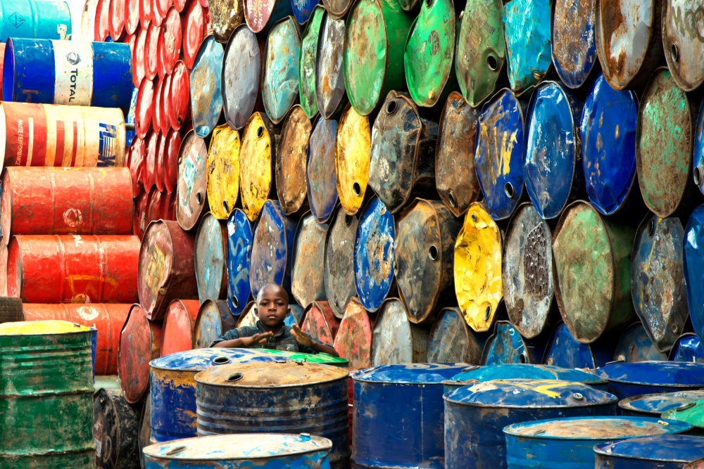 Child Among Colorful Barrels by Florent Dirk Thies — canvas wall art