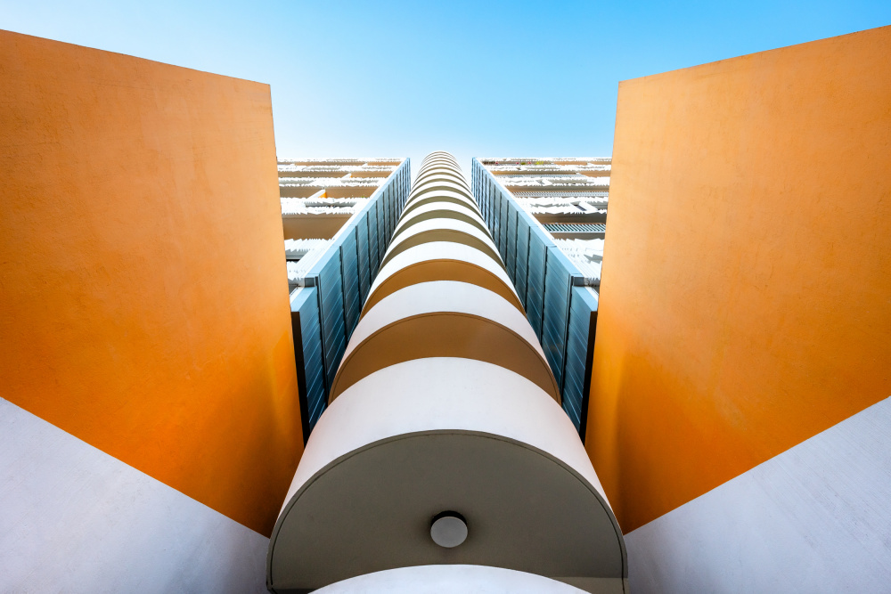 Orange Geometric Building by Hervé Loire — canvas wall art