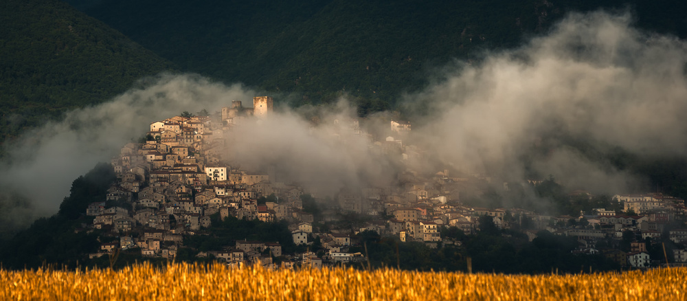 Golden Wheat Misty Village by Riccardo Lucidi — canvas wall art