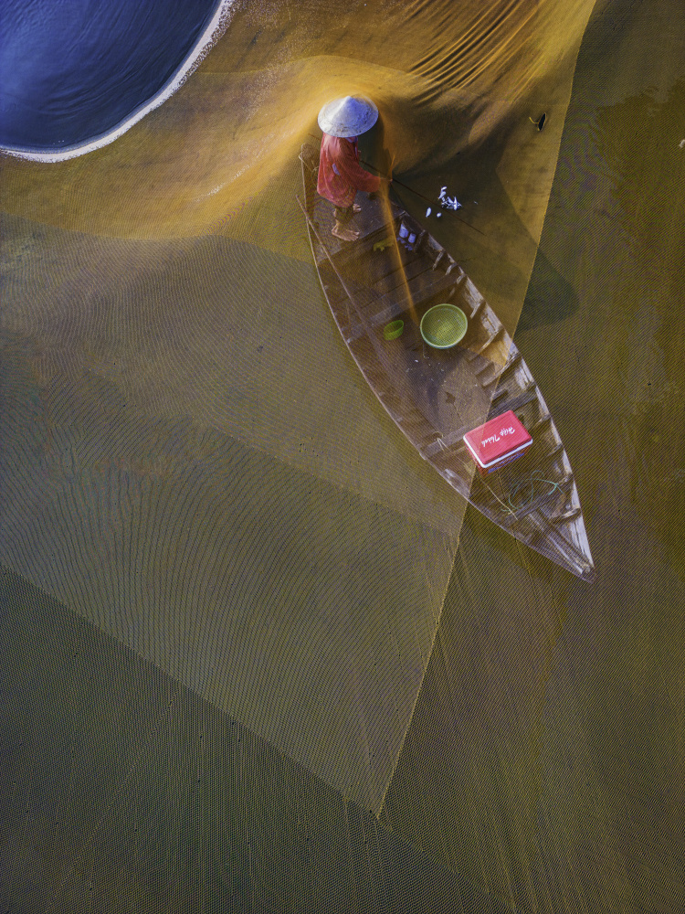 Fisher in Golden Nets by G. KIRAN KUMAR REDDY — canvas wall art