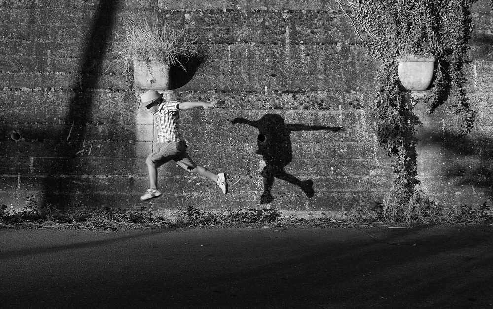 Jumping Boy Shadow by Carlo Ferrara — canvas wall art