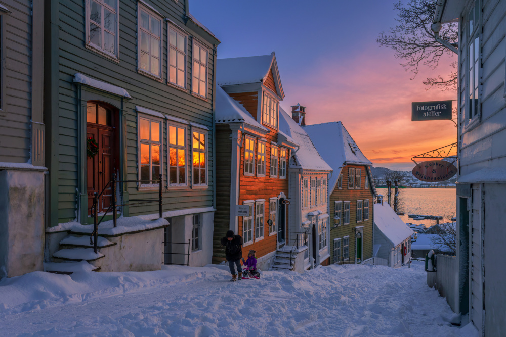 Snowy Village Sunset Glow by Rune Askeland — canvas wall art