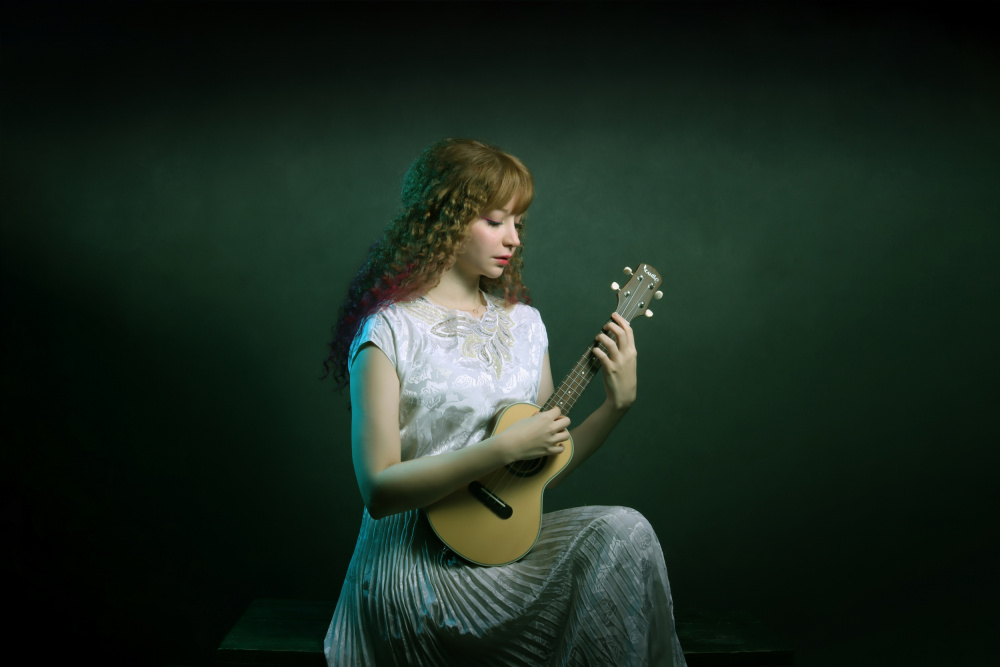 Serene Ukulele Musician by Moein Hasheminasab — canvas wall art