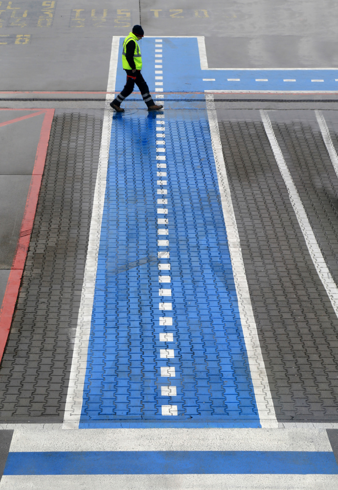 Worker on Blue Walkway by Ralitsa Byalkova — canvas wall art