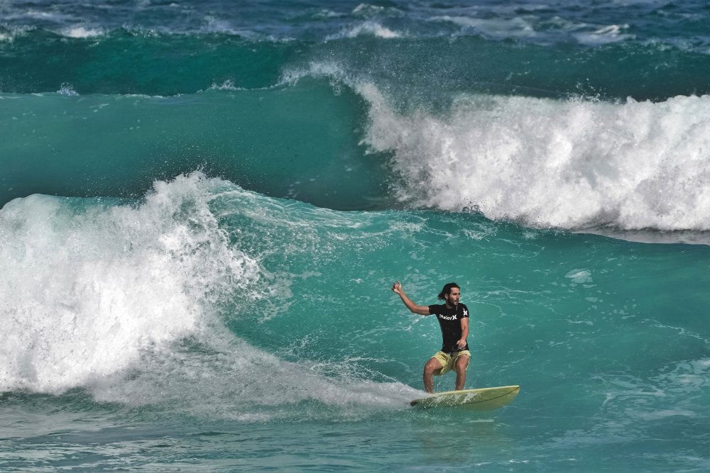 Surfer Riding Ocean Waves by Ayse  Yorgancilar — canvas wall art