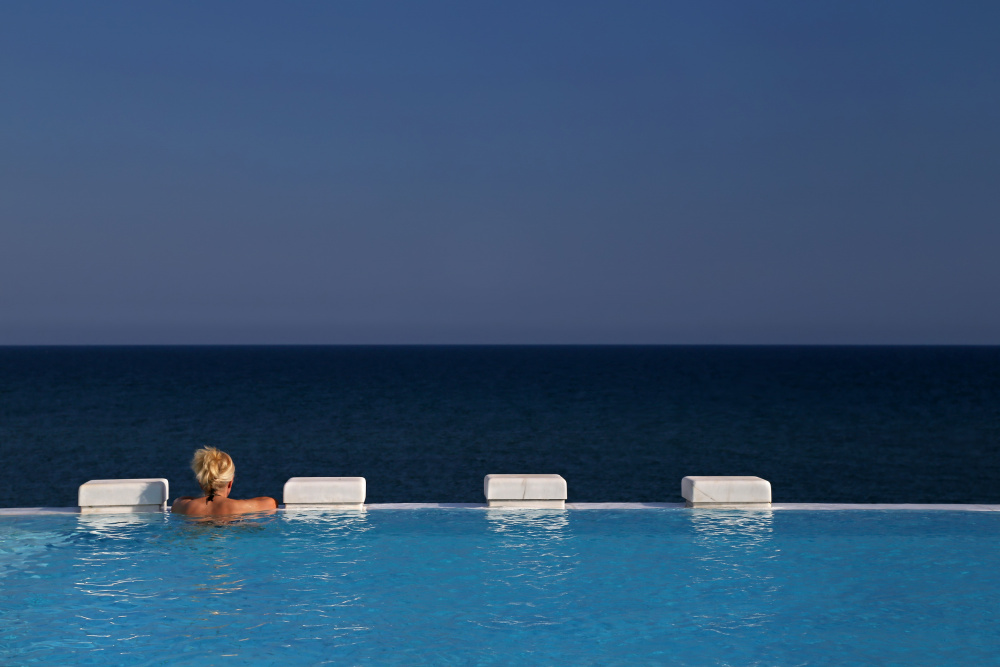Woman In Infinity Pool by Ralitsa Byalkova — canvas wall art