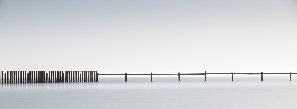 Serene Water Pilings by Lorenza Cancian — canvas wall art