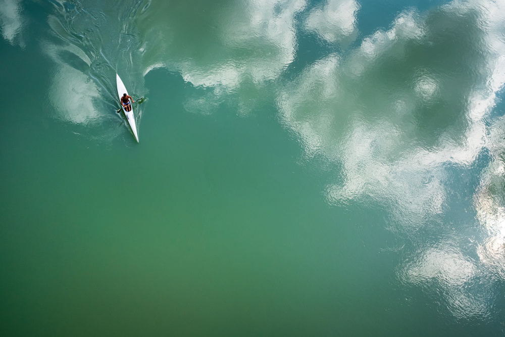 Serene Kayak Reflection by Riccardo Lucidi — canvas wall art