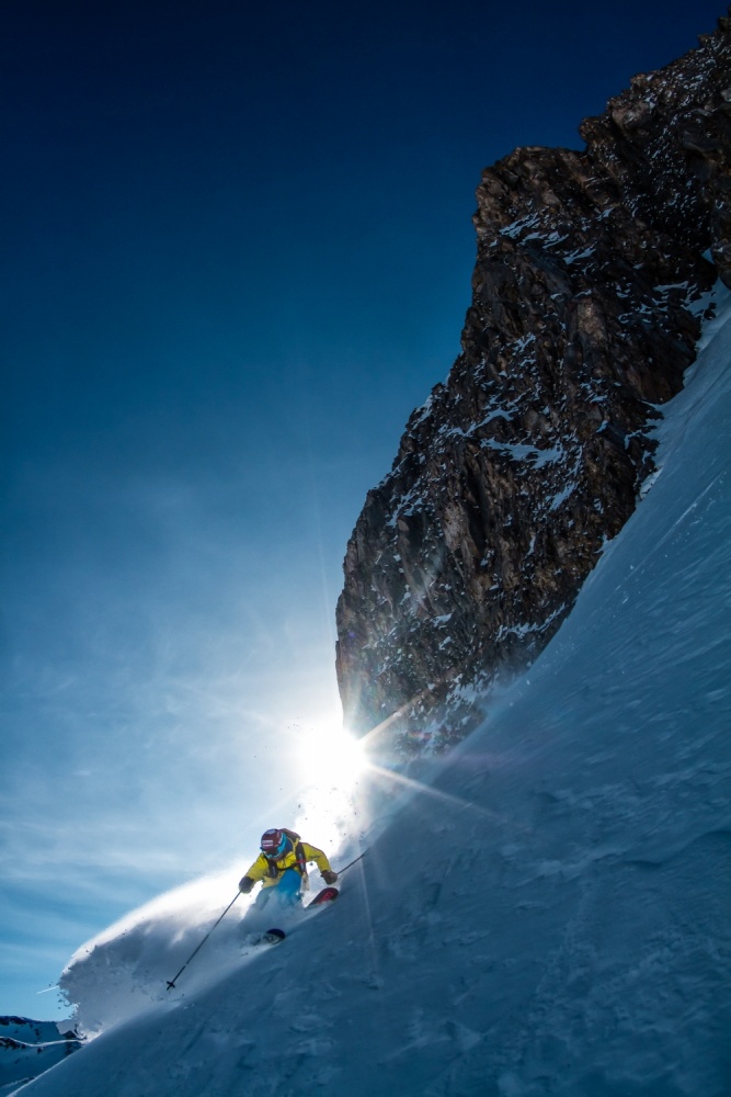 Skier Blasting Powder Sun by Tristan Shu — canvas wall art