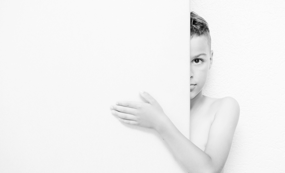 Shy Boy Peeking by Amir Bajrich — canvas wall art