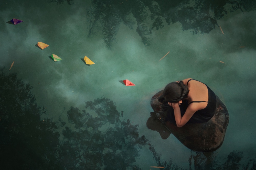 Woman Among Paper Boats by Jay Satriani — canvas wall art