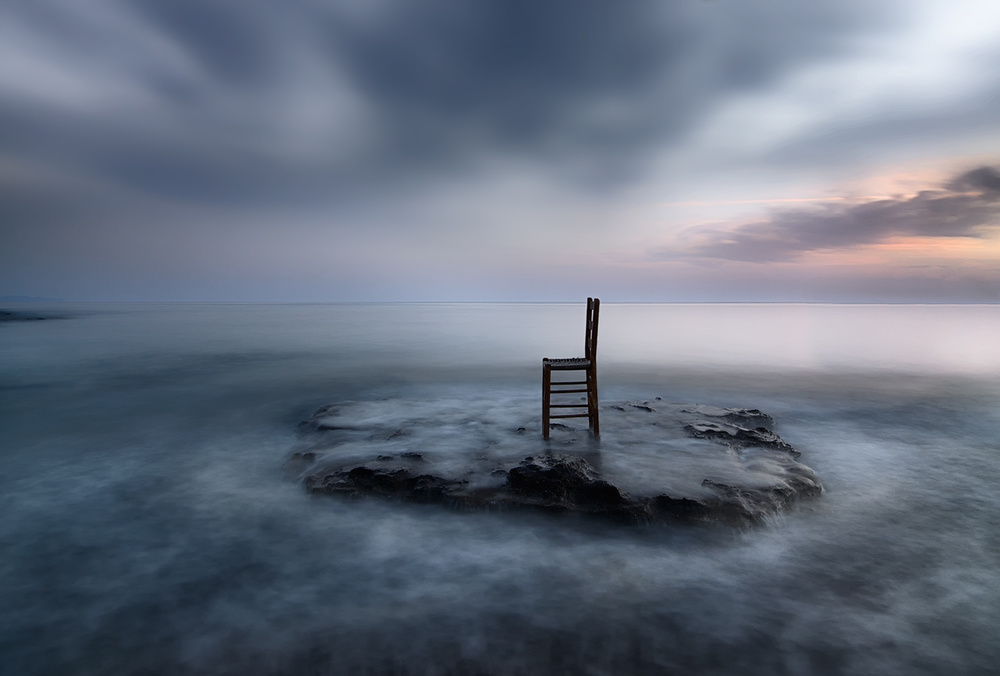 Solitary Chair By The Sea by Maria Kaimaki — canvas wall art