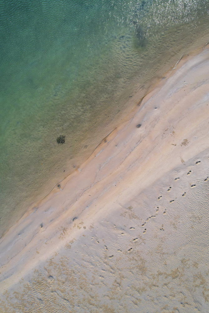 Tranquil Beach Footprints by Anna Kirchner — canvas wall art