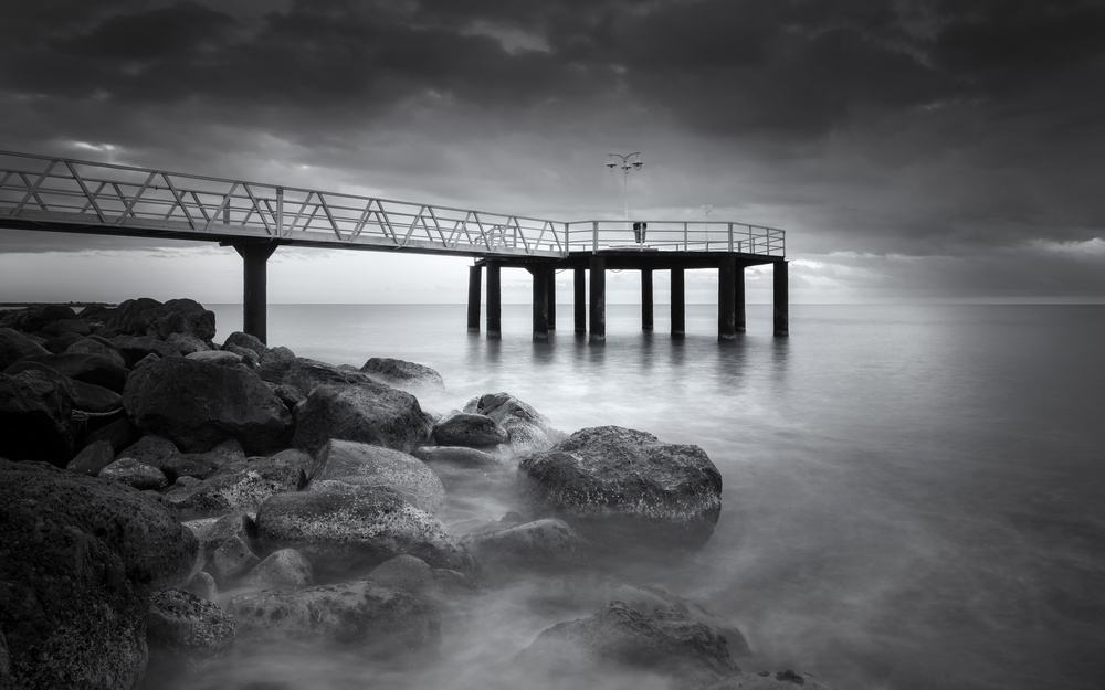 Moody Ocean Pier by Joaquin Guerola — canvas wall art