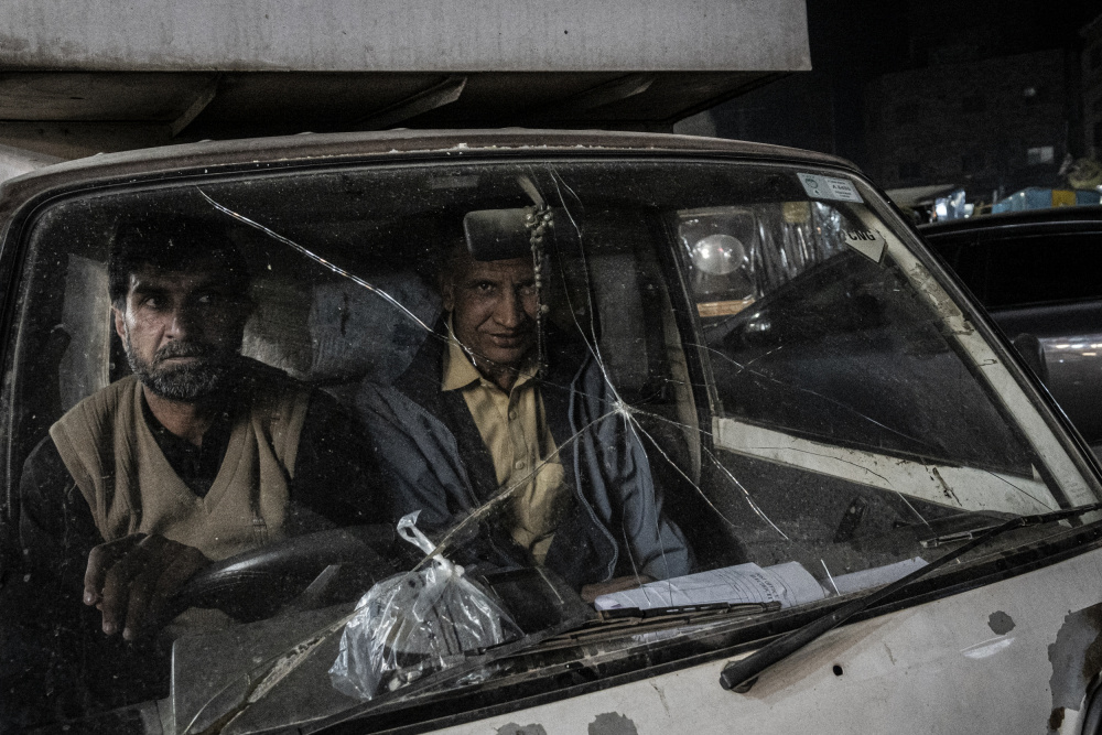 Two Men Through Glass by Elena Molina — canvas wall art