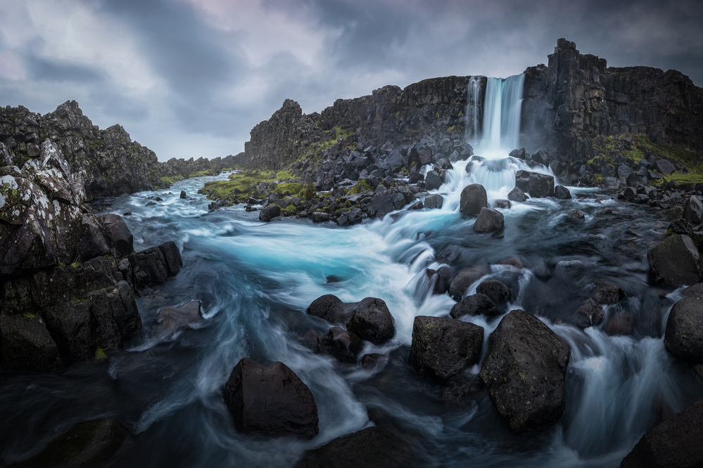 Flowing Blue River Waterfall by Clara Gamito — canvas wall art