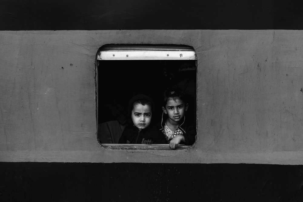 Children At Train Window by Azim Khan Ronnie — canvas wall art
