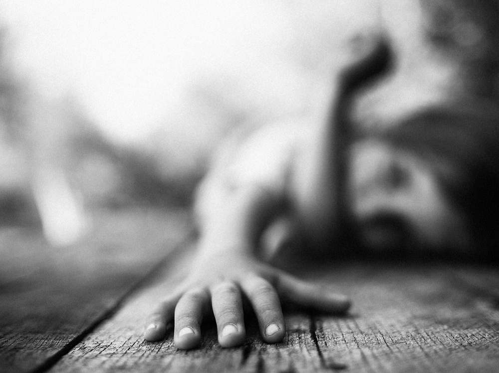Child's Hand on Wood by Amir Bajrich — canvas wall art