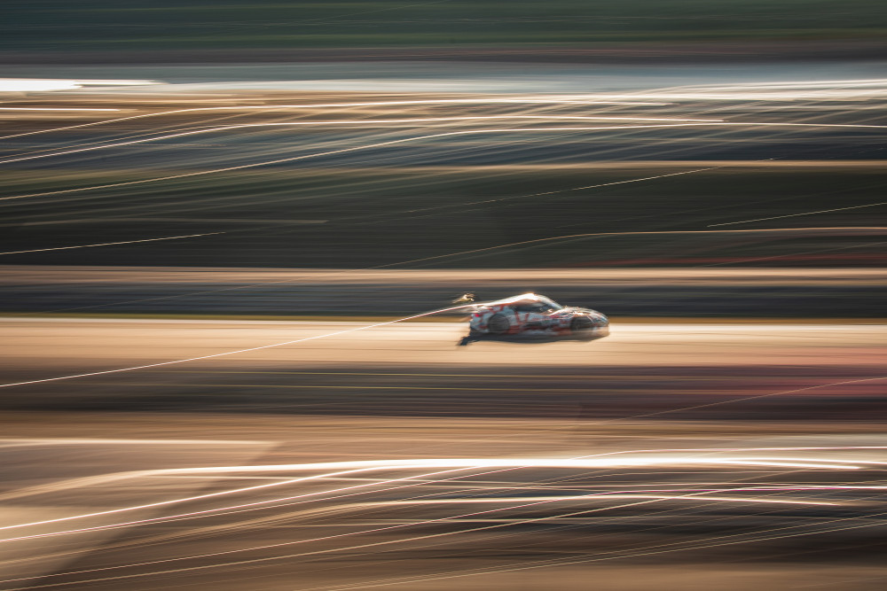 Speeding Race Car by Haruaki Taguchi — canvas wall art