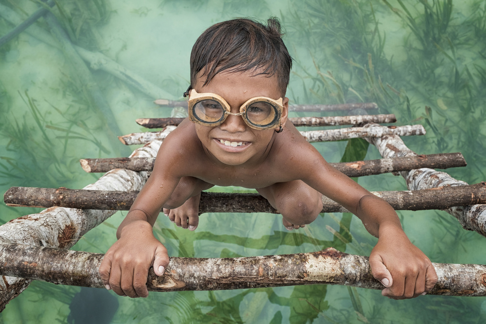 Smiling Boy with Goggles by Muslianshah Masrie — canvas wall art