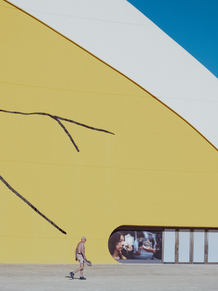 Man Walks Yellow Wall by Alberto García — canvas wall art