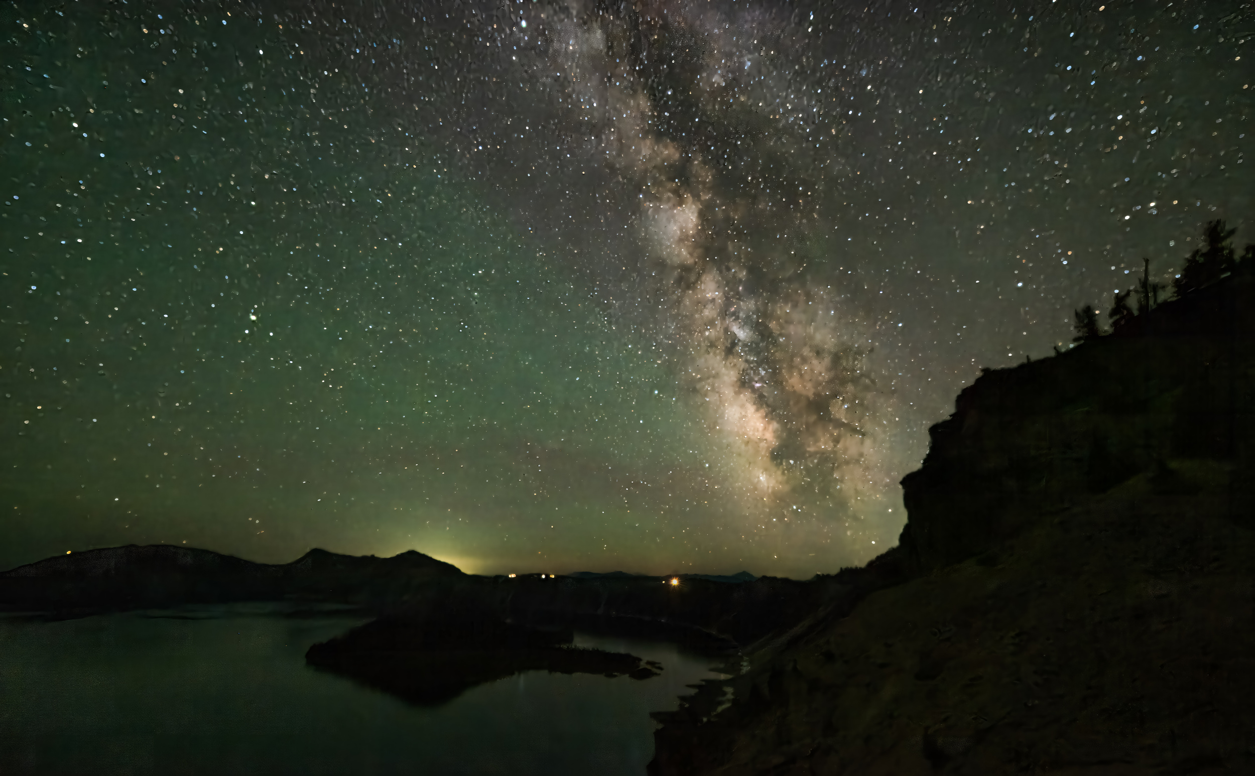 Milky way and northern light together shined over Crater Lake Oregon by ...